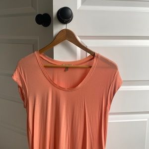 Comfy peach tshirt. So soft with raw cut neckline. Back falls longer than front.